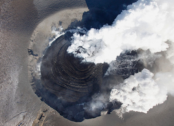Shinmoedake volcano Japan: A view of a dome of lava is seen at a eruptive crater at Shinmoedake peak