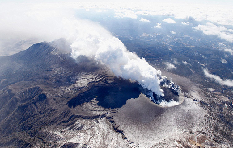 Shinmoedake volcano Japan: An aerial view shows Shinmoedake peak erupting, Japan