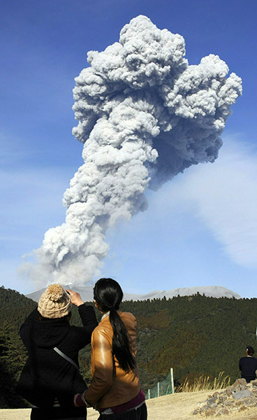 Shinmoedake volcano Japan: White smoke rises from Mount Shinmoedake in Kirishima mountain range, Japan