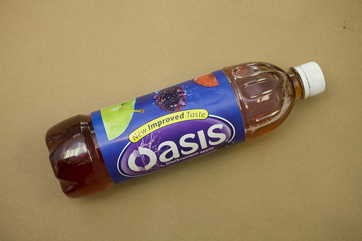 Benefit Fraud: Oasis drink bottle containing camera