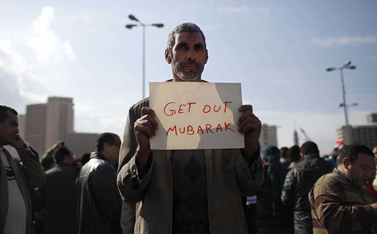 Egypt placards: An anti-government protester with a simple sign in Cairo, Egypt