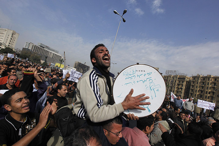 Egypt protests: A musician performs in Tahrir Square