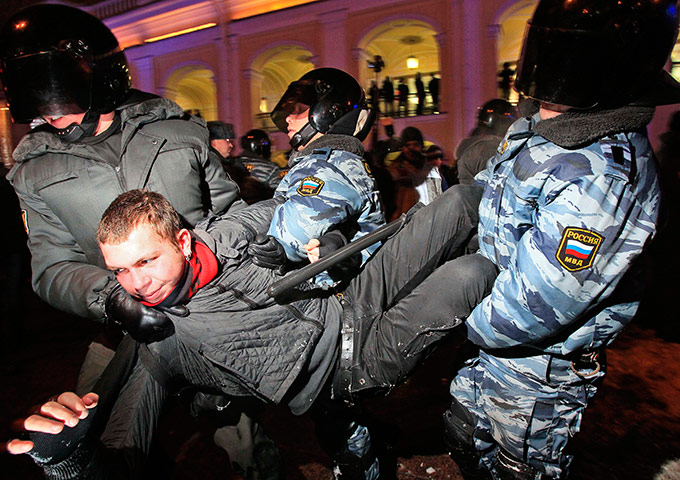 24 hours in pictures: Police officers detain an activist anti-Kremlin protest in St.Petersburg