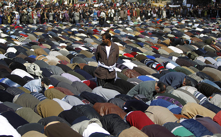 Egypt protests: Demonstrators pray in Tahrir Square in Cairo