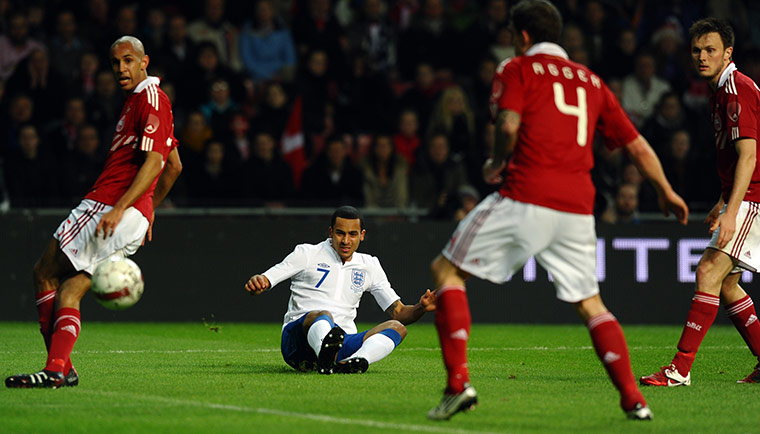 Denmark v England: Theo Walcott crosses the ball for Darren Bent to score