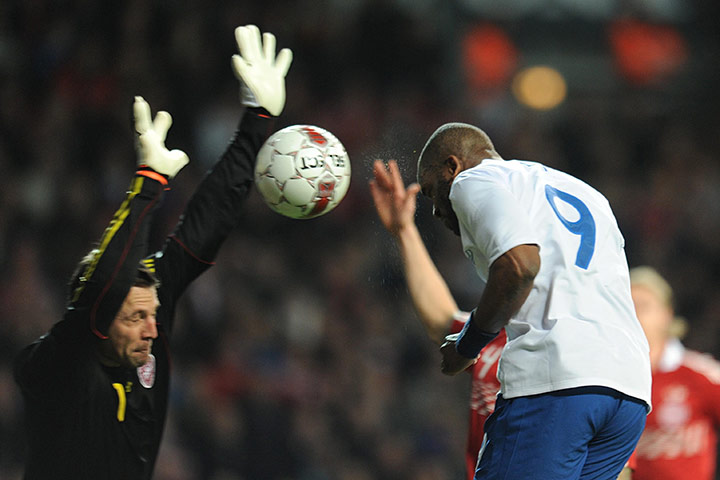 Denmark v England: Thomas Sorensen blocks Darren Bent's header