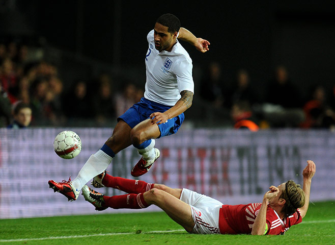 Denmark v England: DenChristian Poulsen tackles Glen Johnson