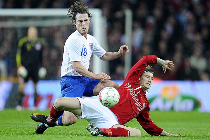 Denmark v England: Scott Parker is tackled by Nicklas Bendtner 