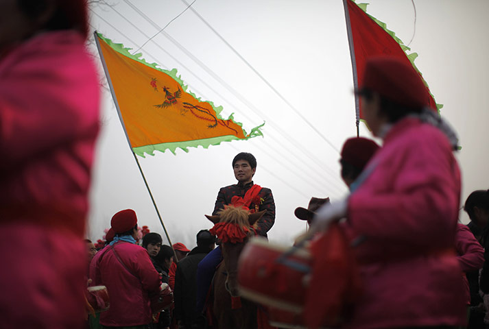 from the agencies: Liu Jian rides a horse during his traditional Chinese wedding