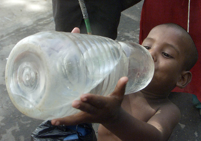 War on Want: A BANGLADESHI BOY DRINKS WATER FROM BOTTLE