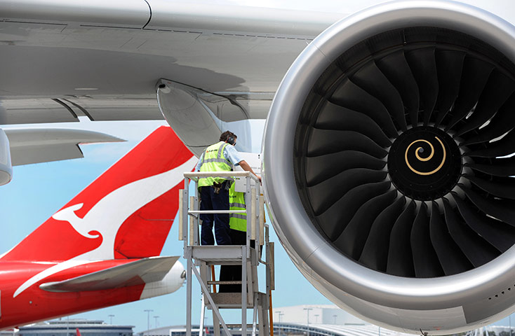 Week in Business: Maintenance crew work on a Rolls-Royce Trent 900 engine