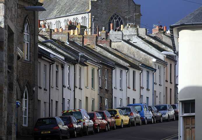 Week in Business: The morning sun illuminates houses in Penzance in Cornwall