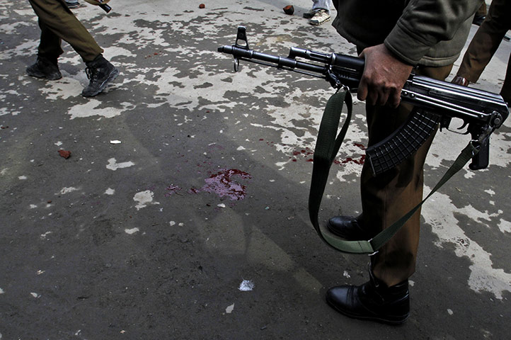 24 hours in pictures: wounded policeman in kashmir
