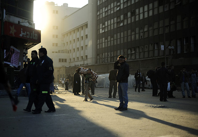 Egypt Day 19: The sun rises on anti-government protesters as they leave Tahrir Square