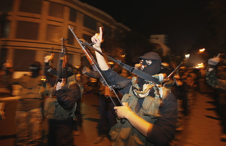 Egypt reaction: Palestinians Hamas militants celebrate the resignation of President Mubarak