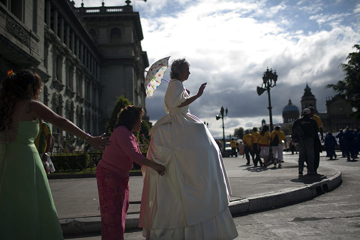 24 Hours: A Guetamalan woman in a senior citizens parade for Saint Valentine's Day