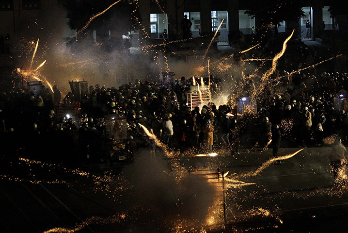 24 Hours: Participants launch themselves into a barrage of fireworks in Taiwan