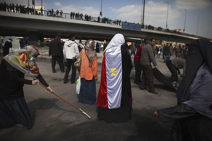 Egypt Day 19: Egyptian volunteers help to clean up the roads near Tahrir Square