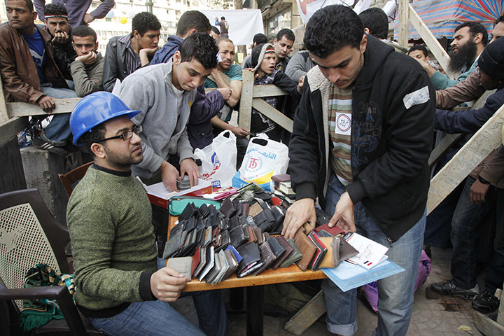 Egypt Day 19: Egyptian protesters set up a desk for found wallets in Tahrir Square