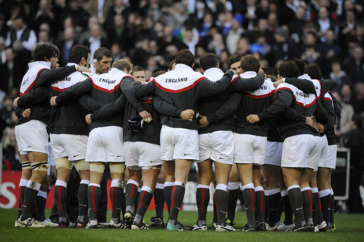 England v Italy: The England players huddle before kick off