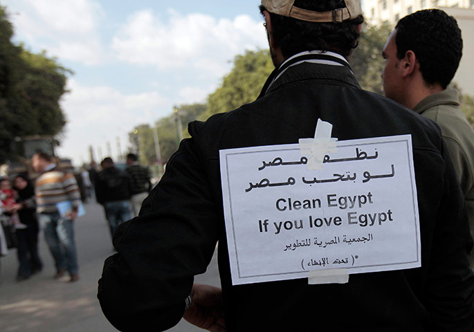 Egypt aftermath: Opposition supporters continue clean-up work in Tahrir Square in Cairo