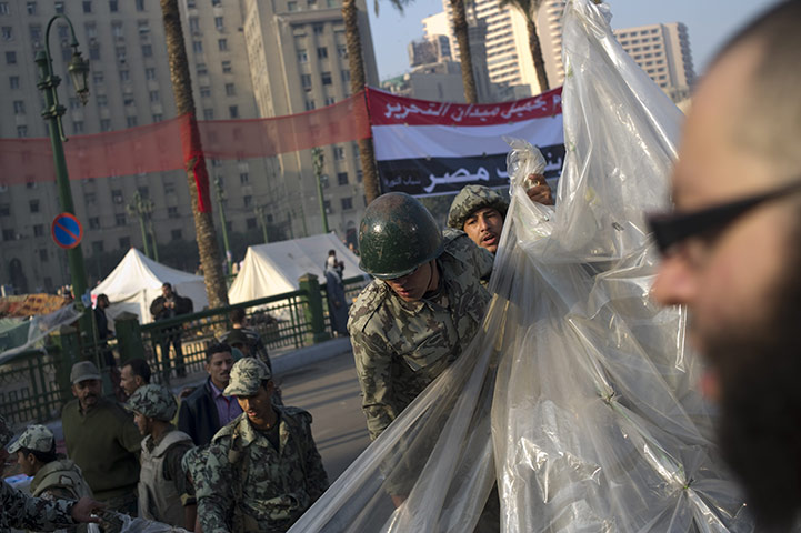 Egypt aftermath: Egyptian soldiers dismantle a tent used by protestors
