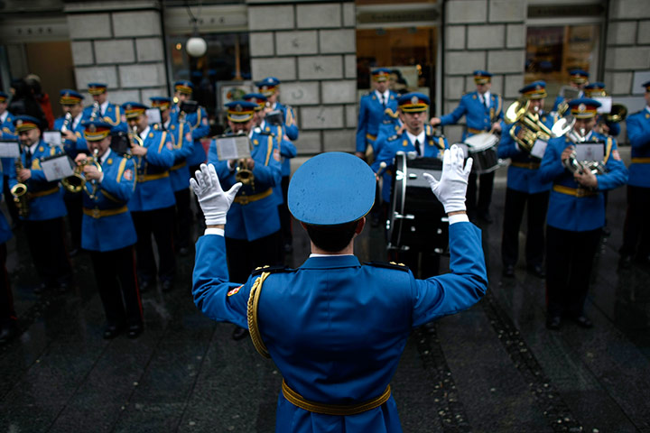 24 hours in pictures: A military orchestra performs on a street, Belgrade