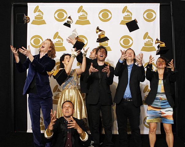 Grammy Awards: Rock group Arcade Fire throws their awards in the air