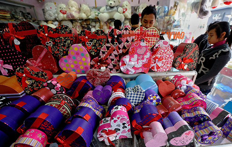 Valentine's Day: Hanoi , Vietnam: Young people browse for Valentine Day's gifts at a shop