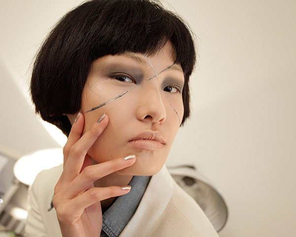 New York Fashion Week: A model prepares for the Park Choon Moo show