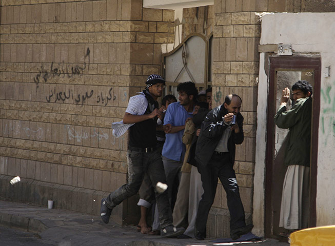 middle east unrest: Pro-government protesters throw stones  in 