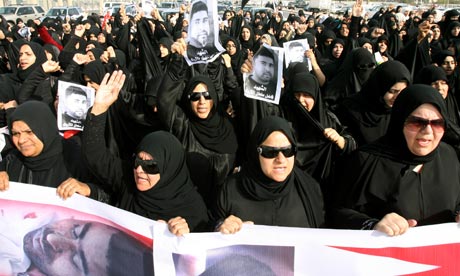 Hundreds of Bahraini protesters shout slogans as the attend the funeral of Fadel Salman Matrouk