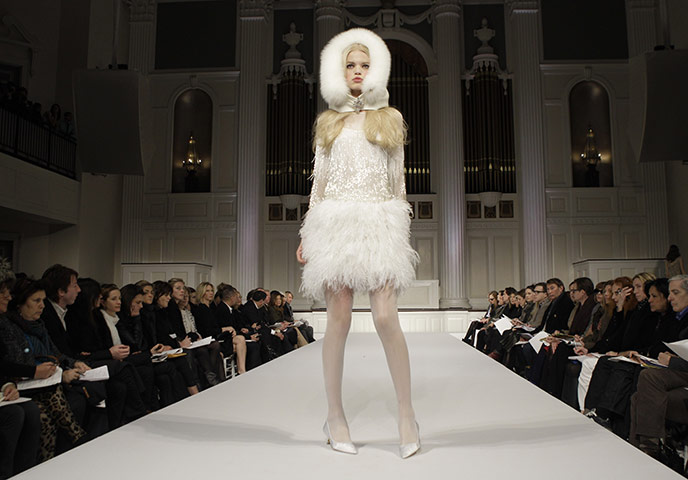 New York Fashion 160211: A model pauses on the runway at the Oscar de la Renta Fall 2011 show