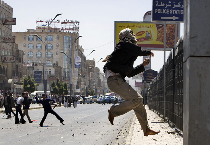 Yemen: A Yemeni anti-government protester jumps