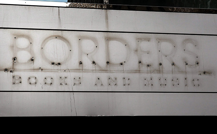 Week in Business: Remains of a sign on a closed Borders in Chicago