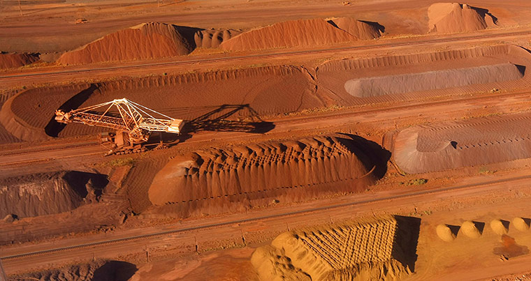 Week in Business: A bucket wheel reclaimer collects ore at the BHP Billiton iron ore 
