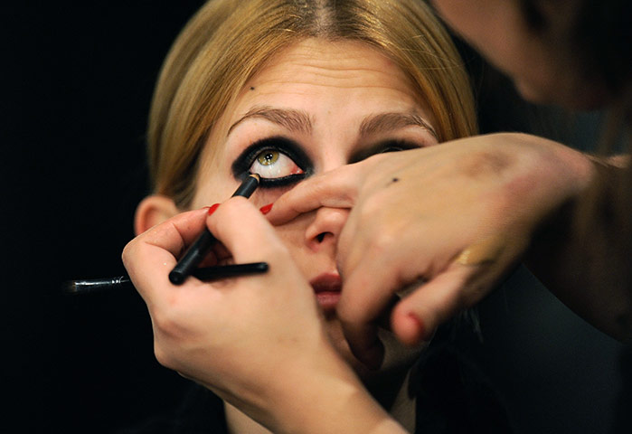 24 Hours In Pix: A model is maked up backstage