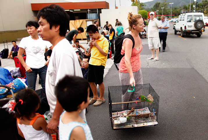Cyclone Yasi preparations: Local resident waits outside an emergency cyclone shelter in Cairns 