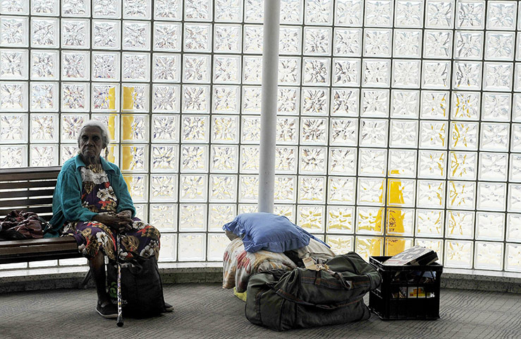 Cyclone Yasi preparations: An elderly lady sits in the emergency evacuation centre in Earlville