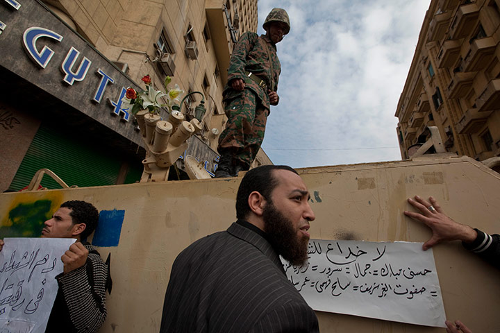 Sean Smith in Cairo: Protestors and demonstrators stand next to a tank in Tahrir Square 