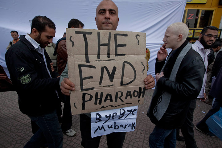 Sean Smith in Cairo: Protestor holding sign against Hosni Mubarak in Tahrir Square