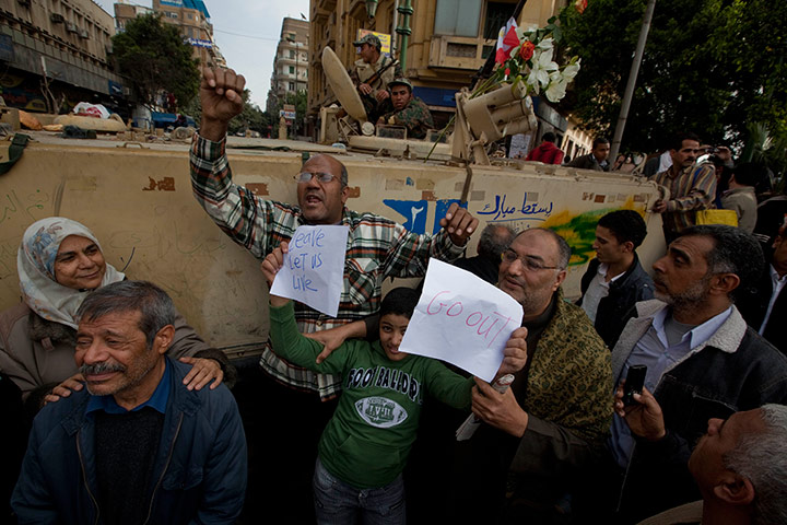 Sean Smith in Cairo: Protestors and demonstrators stand next to a tank in Tahrir Square