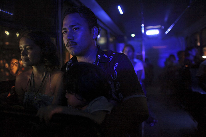 FTA Alexandre Meneghini: Frederico Martinez, 25, a bus driver, rides on a bus with his family