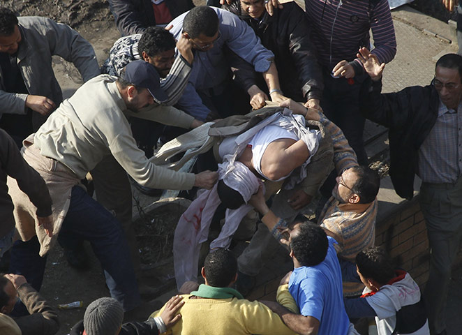 Battle for Egypt: Demonstrators for and against the government clash in Cairo