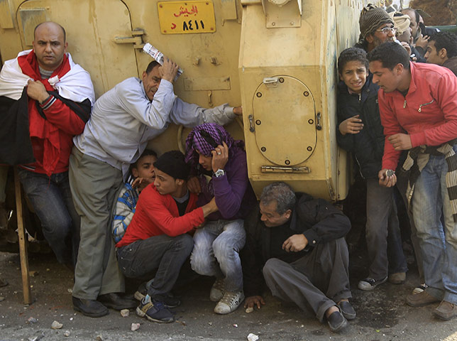 Battle for Egypt: Demonstrators for and against the government clash in Cairo