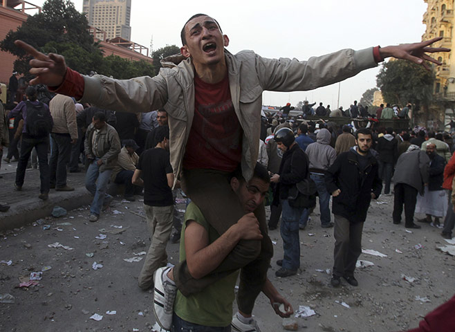Battle for Egypt: Demonstrators for and against the government clash in Cairo