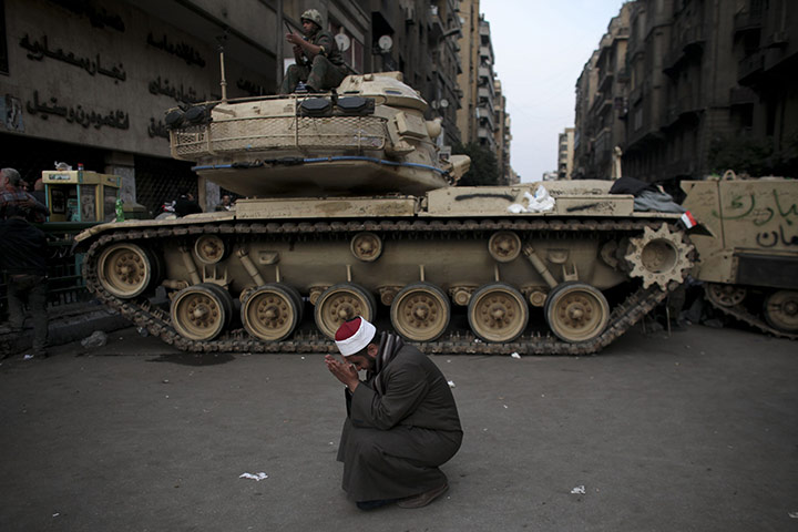 Battle for Egypt: Demonstrators for and against the government clash in Cairo