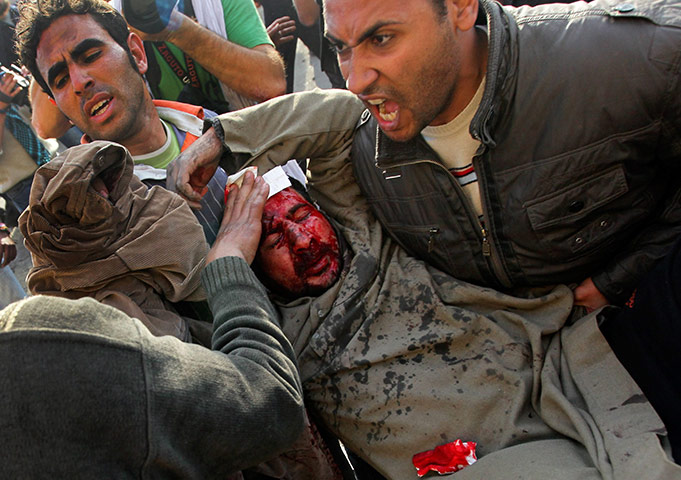 Battle for Egypt: Demonstrators for and against the government clash in Cairo