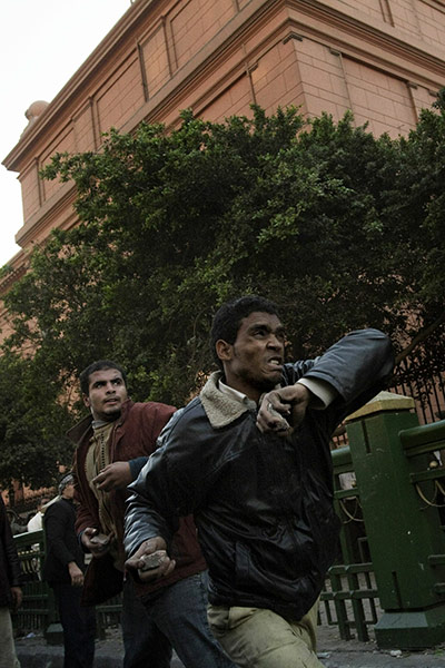 Battle for Egypt: Demonstrators for and against the government clash in Cairo