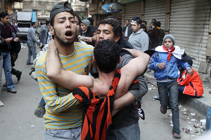 Battle for Egypt: Demonstrators for and against the government clash in Cairo